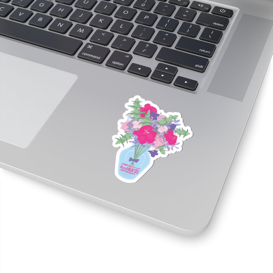 Laptop with a floral sticker on the palm rest area