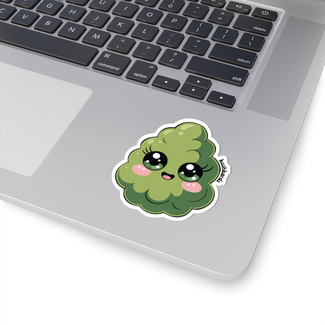 Laptop with a cute nug sticker with facial expression on a mac book computer