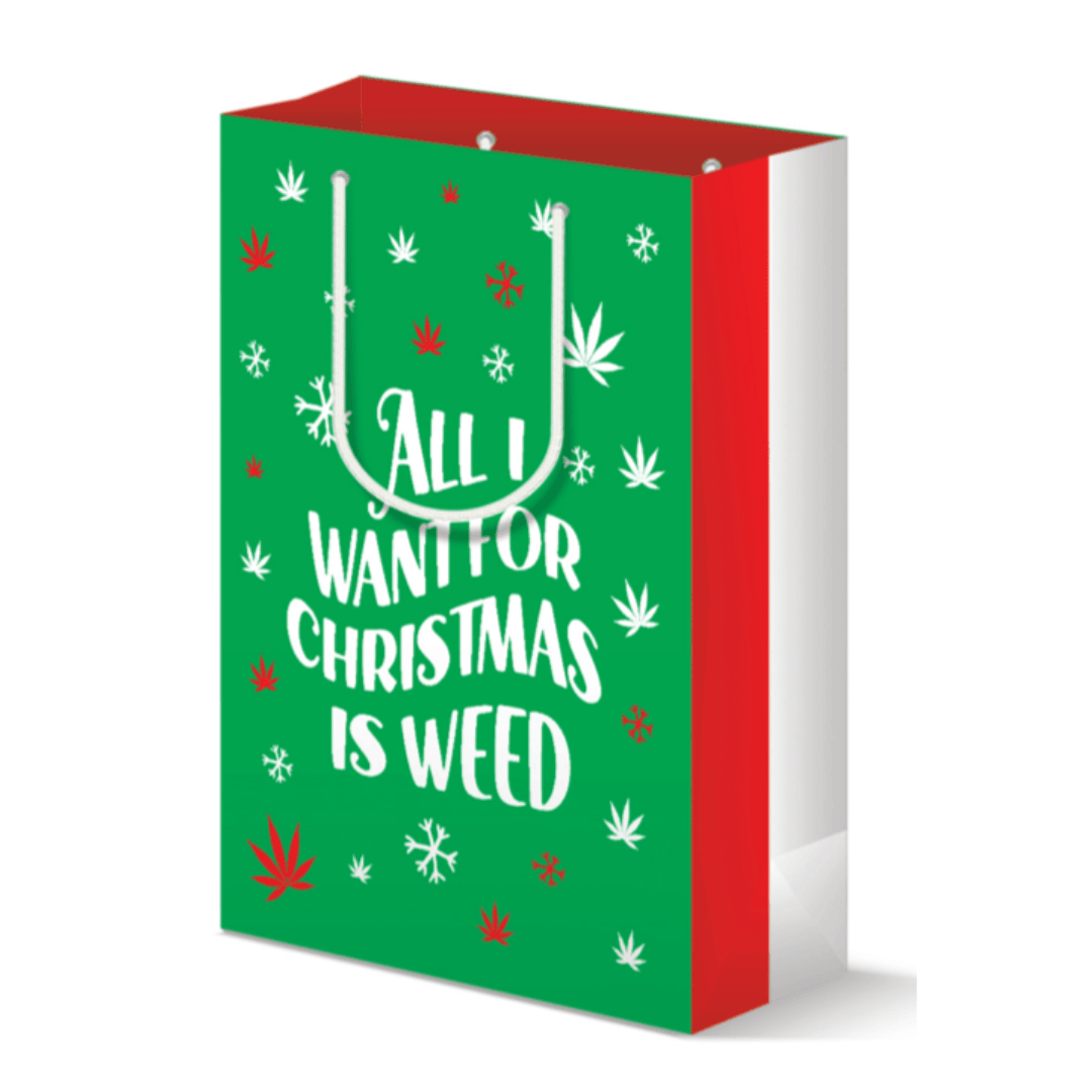 Green large gift bag with 'All I Want For Christmas is Weed' festive print and red and white striped sides, perfect for wrapping holiday presents with a playful and cheery touch.