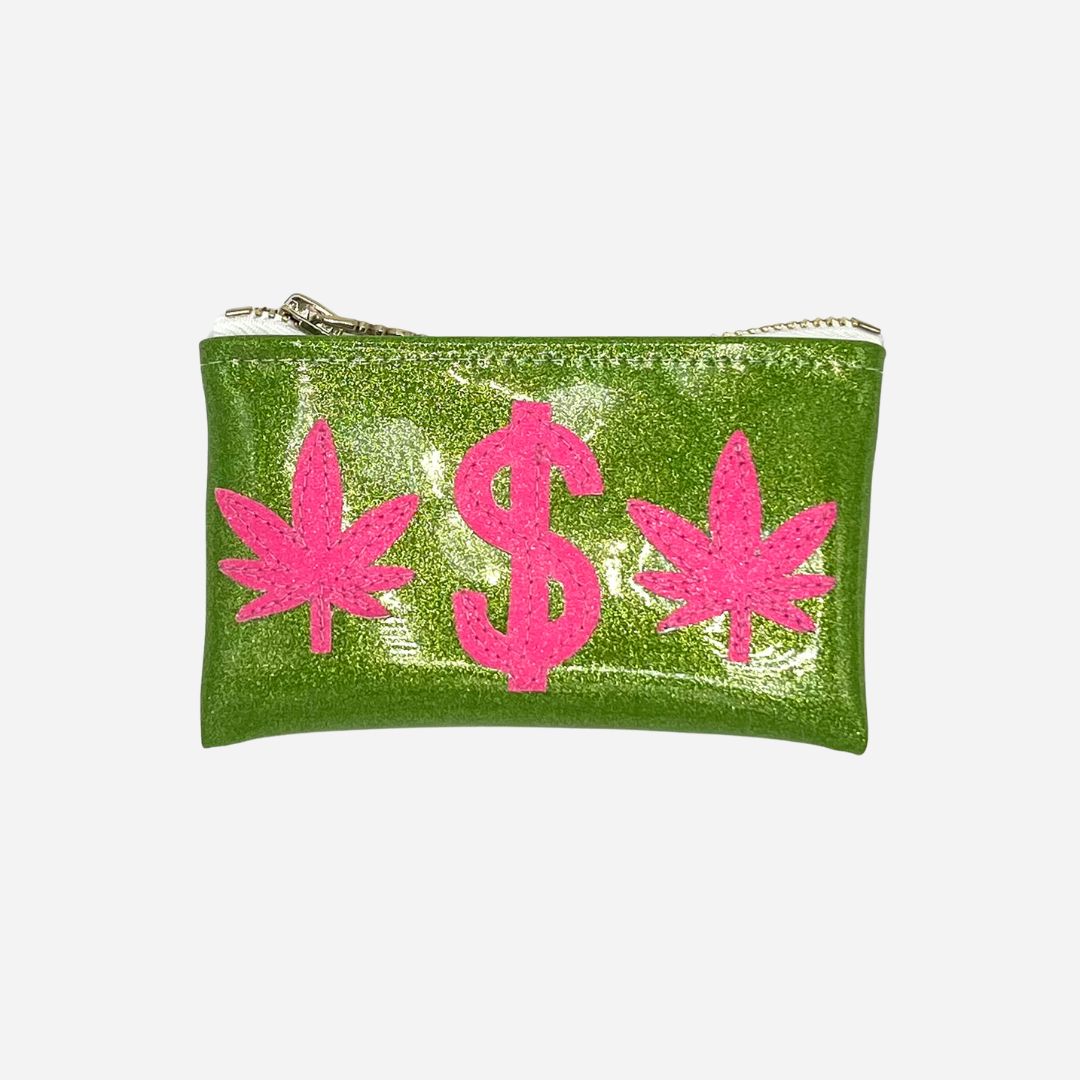 Green glitter vinyl keychain clutch with pink glitter cannabis leaf and dollar sign appliqué on a bright green background.