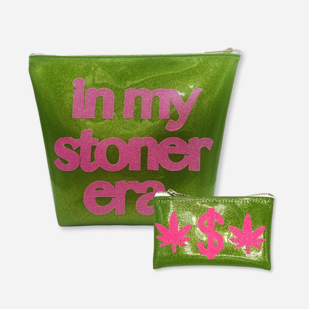 A bold travel set featuring a black “STONER” travel bag and a hot pink & green “Weed Money” keychain clutch—perfect for carrying cannabis essentials with style.