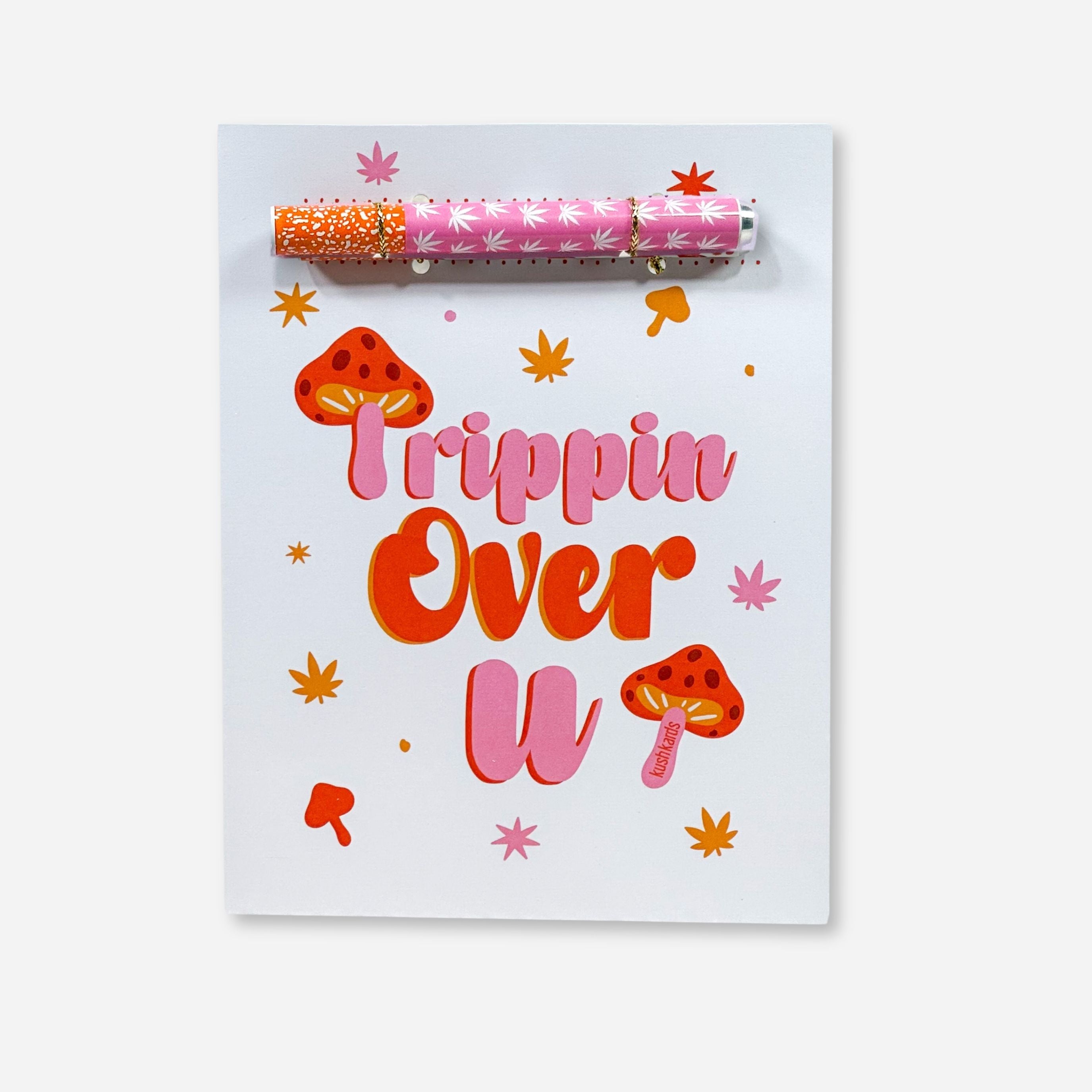 Trippin Over You Text with pink and orange accents on a white background with a pink and white pot leaf one hitter