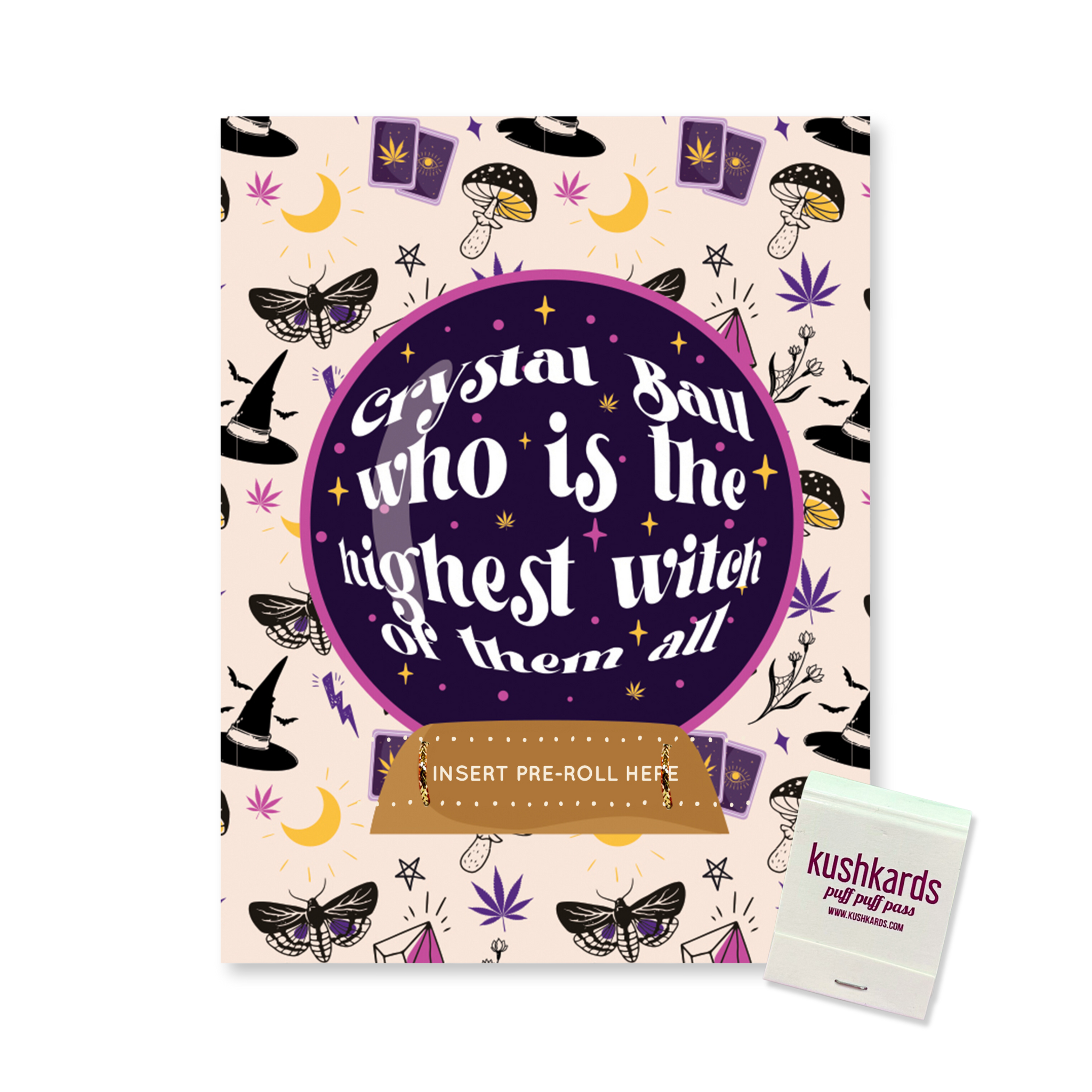 A greeting card with a magical theme on a purple background. It features illustrations of celestial objects, mushrooms, and moths. A central crystal ball contains the text "Crystal Ball who is the highest witch of them all," and a slot is labeled "INSERT PRE-ROLL HERE." A matchbook is visible at the bottom right.