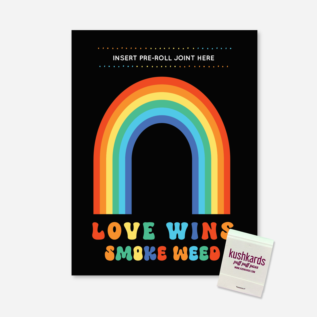 Black Greeting Card with a Rainbow and text " Love Wins Smoke Weed" in multiple colors with a slot to insert a pre roll and a branded kushkards matchbook on a light grey background