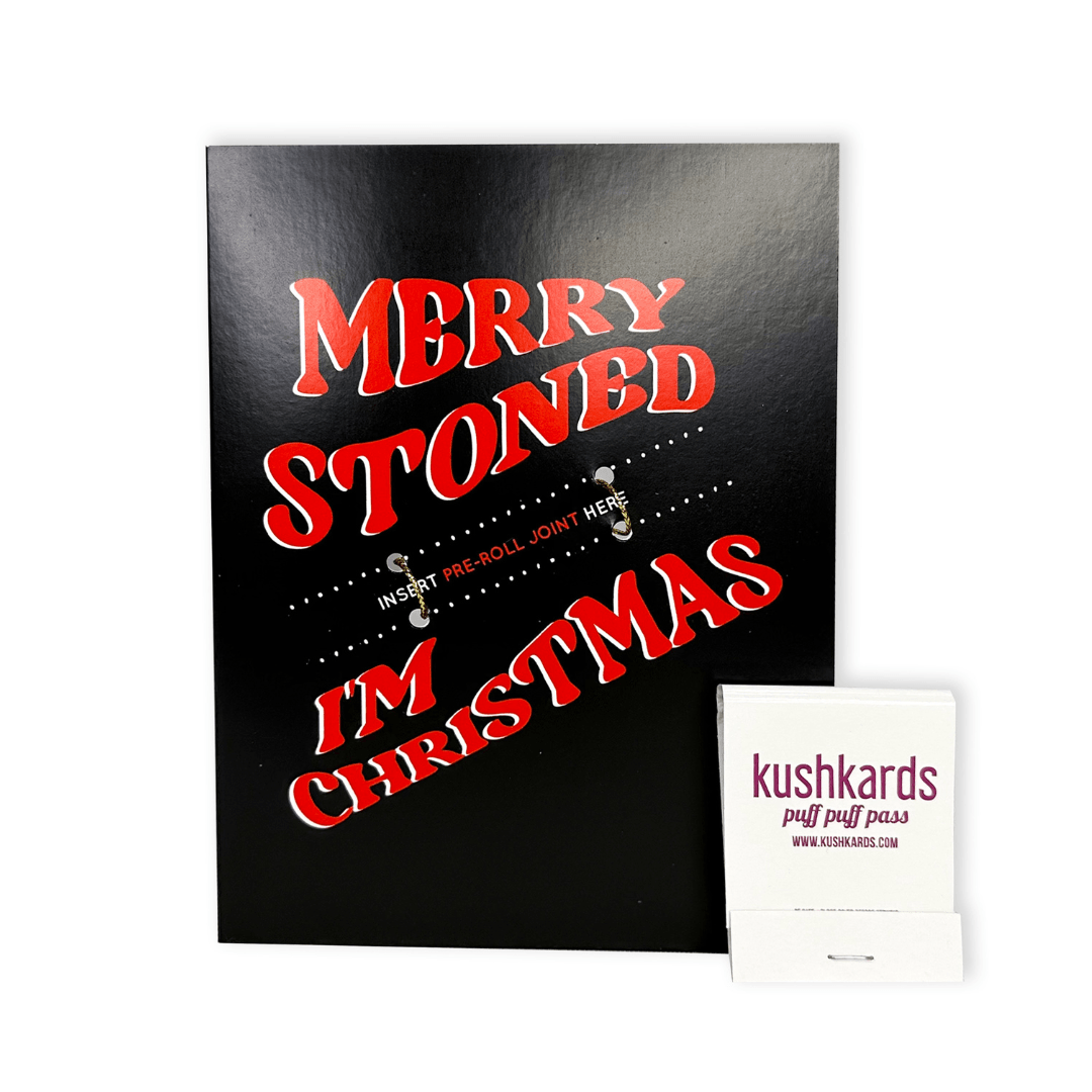 Black greeting card with bold red text saying 'Merry Stoned I'm Christmas', perfect for spreading holiday cheer with a touch of humor and playfulness. Includes matches.