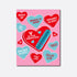 A playful and suggestive greeting card with a pink background, decorated with various candy hearts in shades of blue and red, each featuring flirty and provocative phrases. A large heart in the center displays a blue vibrator with the text &