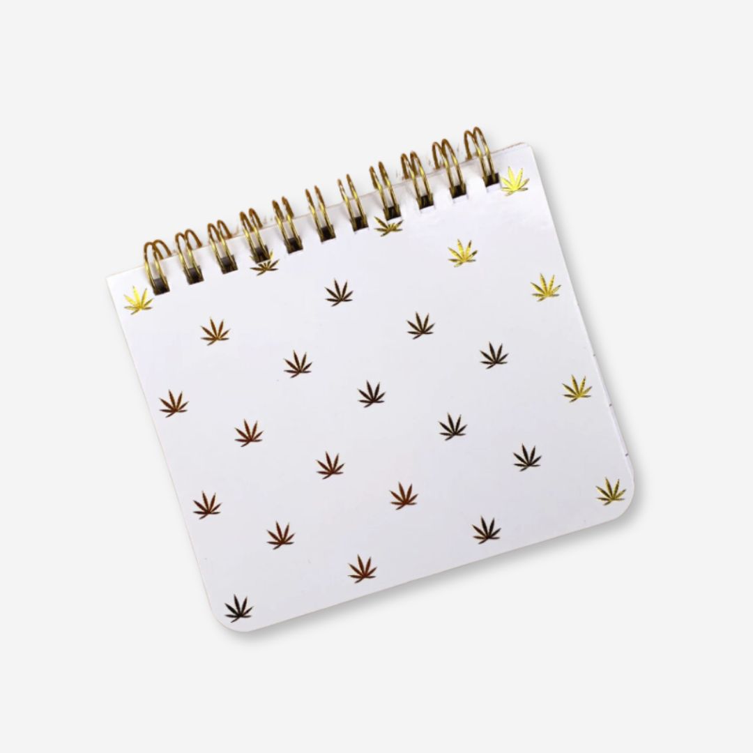 4.25" x 3.5" white mini notebook with gold cannabis leaf design, lined pages, and "High-Dea of the Day" headers.
Let me know if you need any more adjustments! 🌿✨