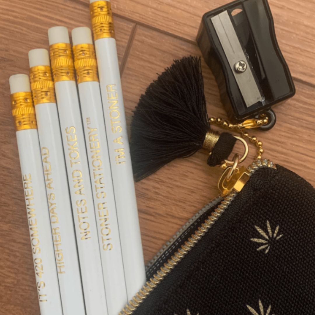 Cannabis-themed pencil pouch (8" x 3") with gold leaf design and stoner pencil set for creative writing.