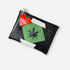 A black glittery pouch with a green pot leaf cut out of the center. The pouch has a zipper closure and a red heart-shaped tag that reads "Julie Mollo" attached to the zipper pull.