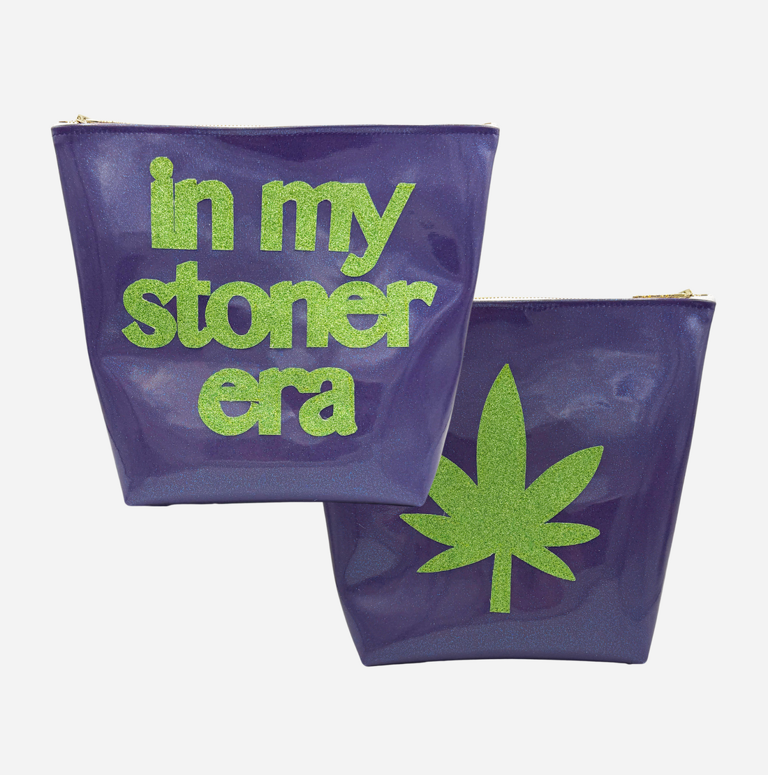 Two purple travel bags with green text In my stoner era and a marijuana leaf design on a white background