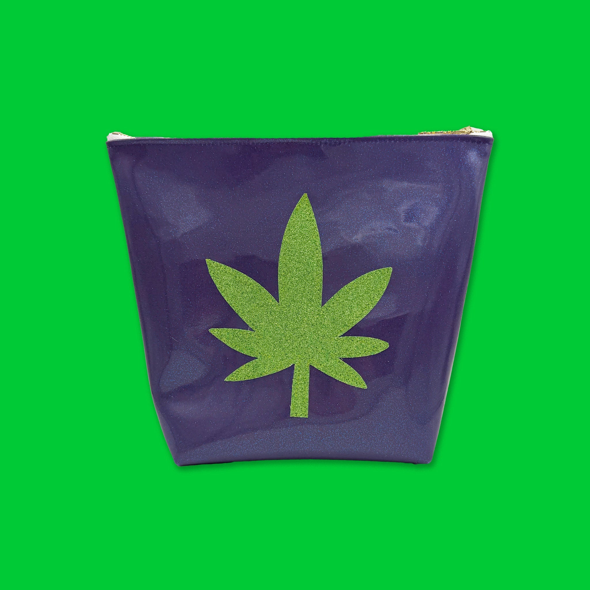 Purple TRAVEK BAG with a green cannabis leaf on a green background