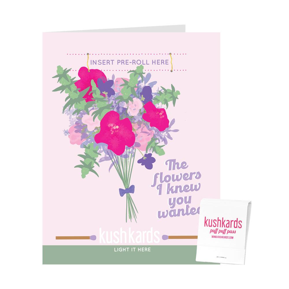 Flowers in a vase with text " the flowers I knew you wanted" with a slot to insert a pre roll and a branded kushkards matchbook
