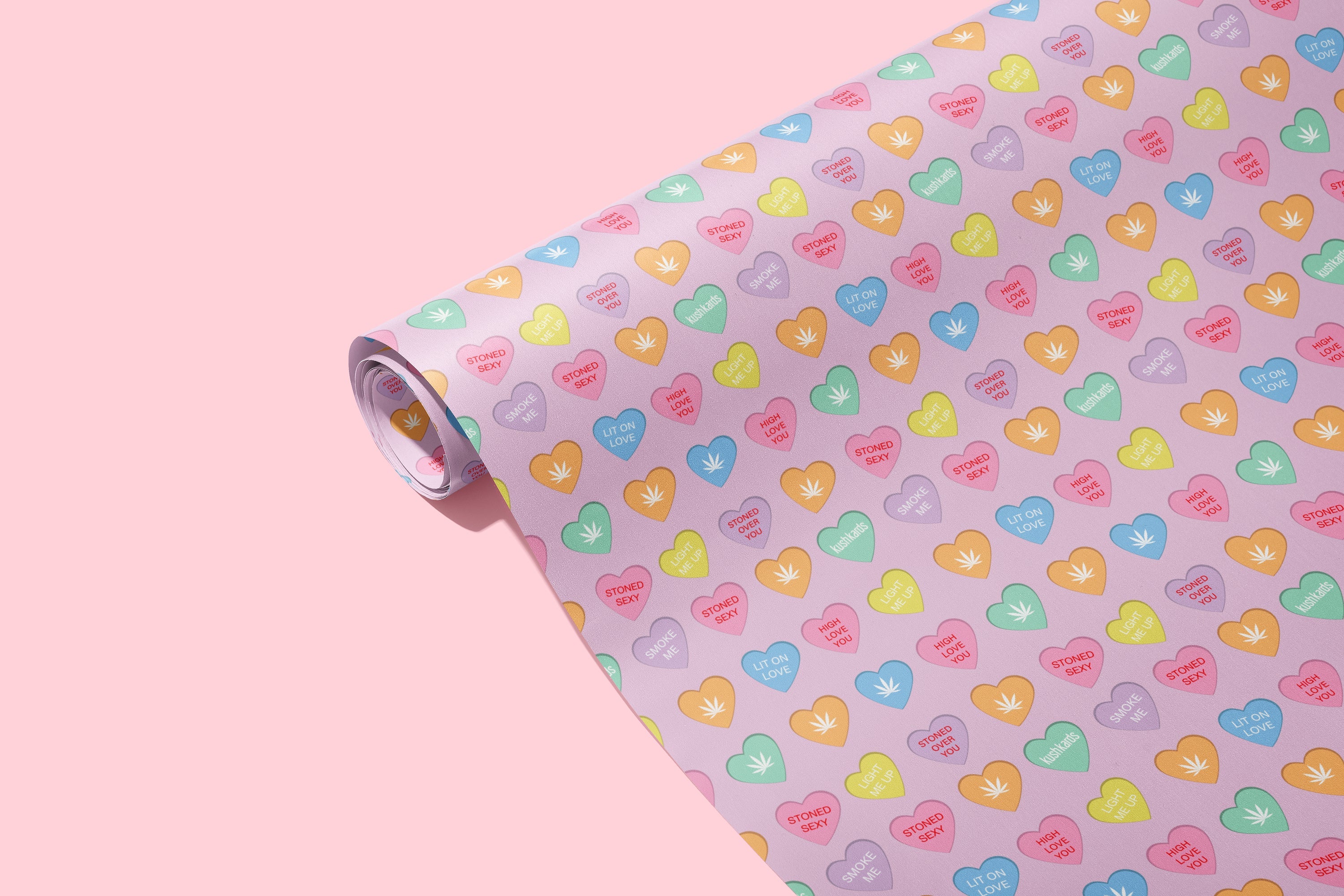 colorful stoner sweet hearts wrapping paper image on light pink background 