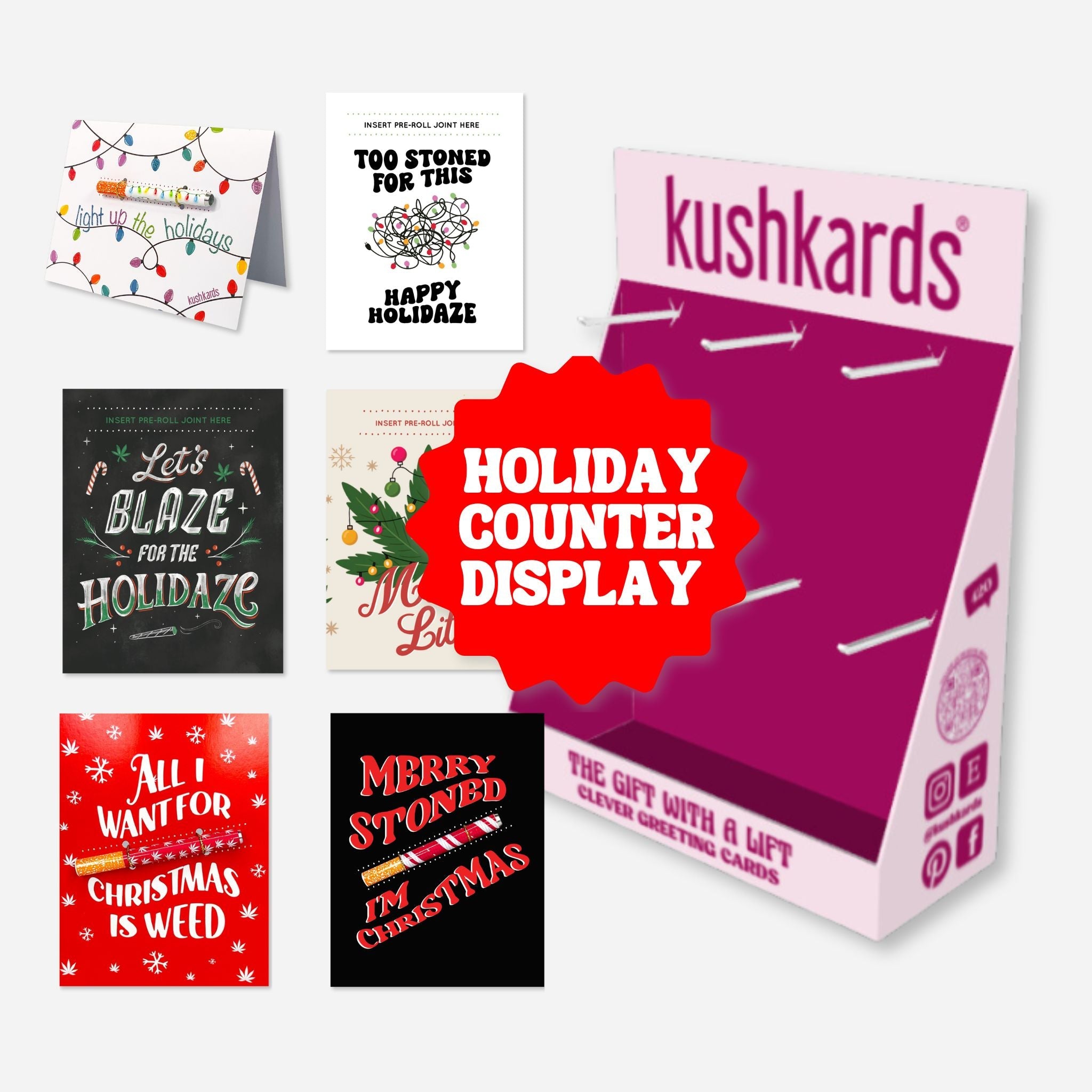 Kushkards holiday card display with various cards and a prominent &
