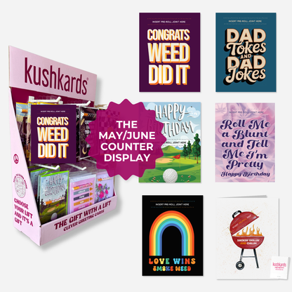 Display of Kushkards cards with various designs and text, including &
