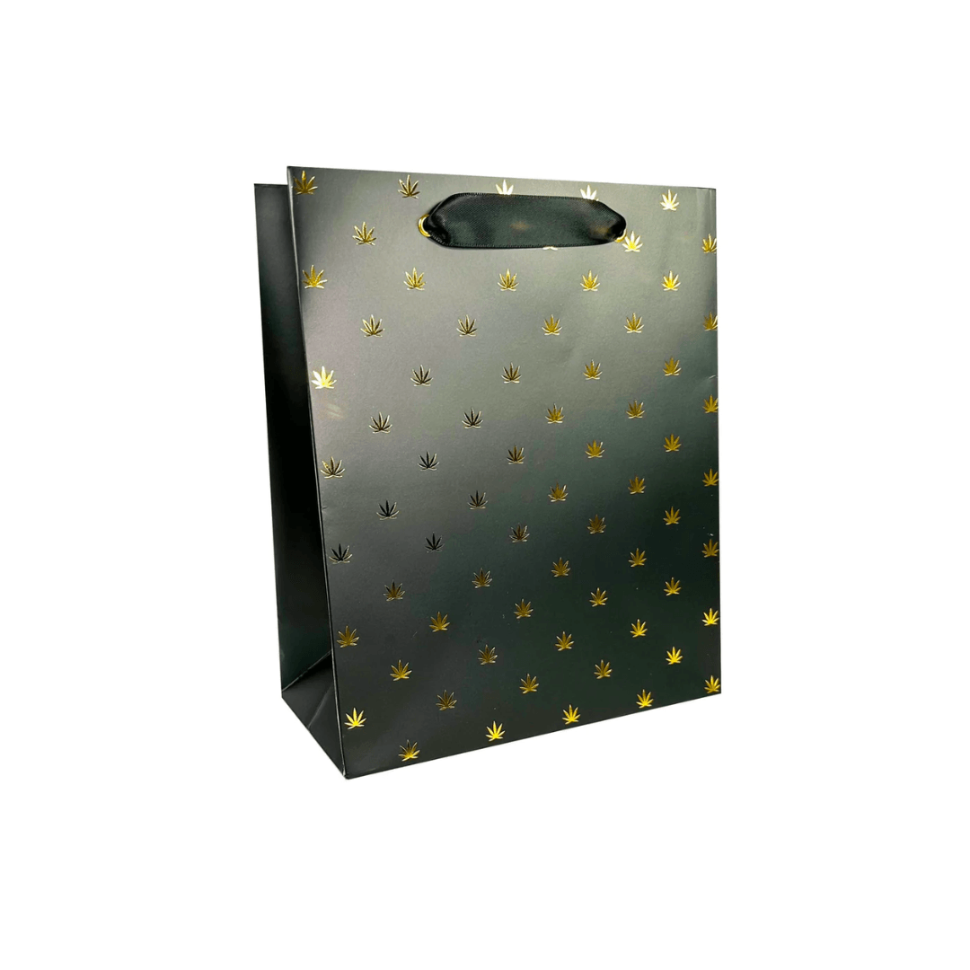 A luxurious and sophisticated gift bag featuring a stunning black and gold pot leaf print, making it a standout choice for your holiday presents.