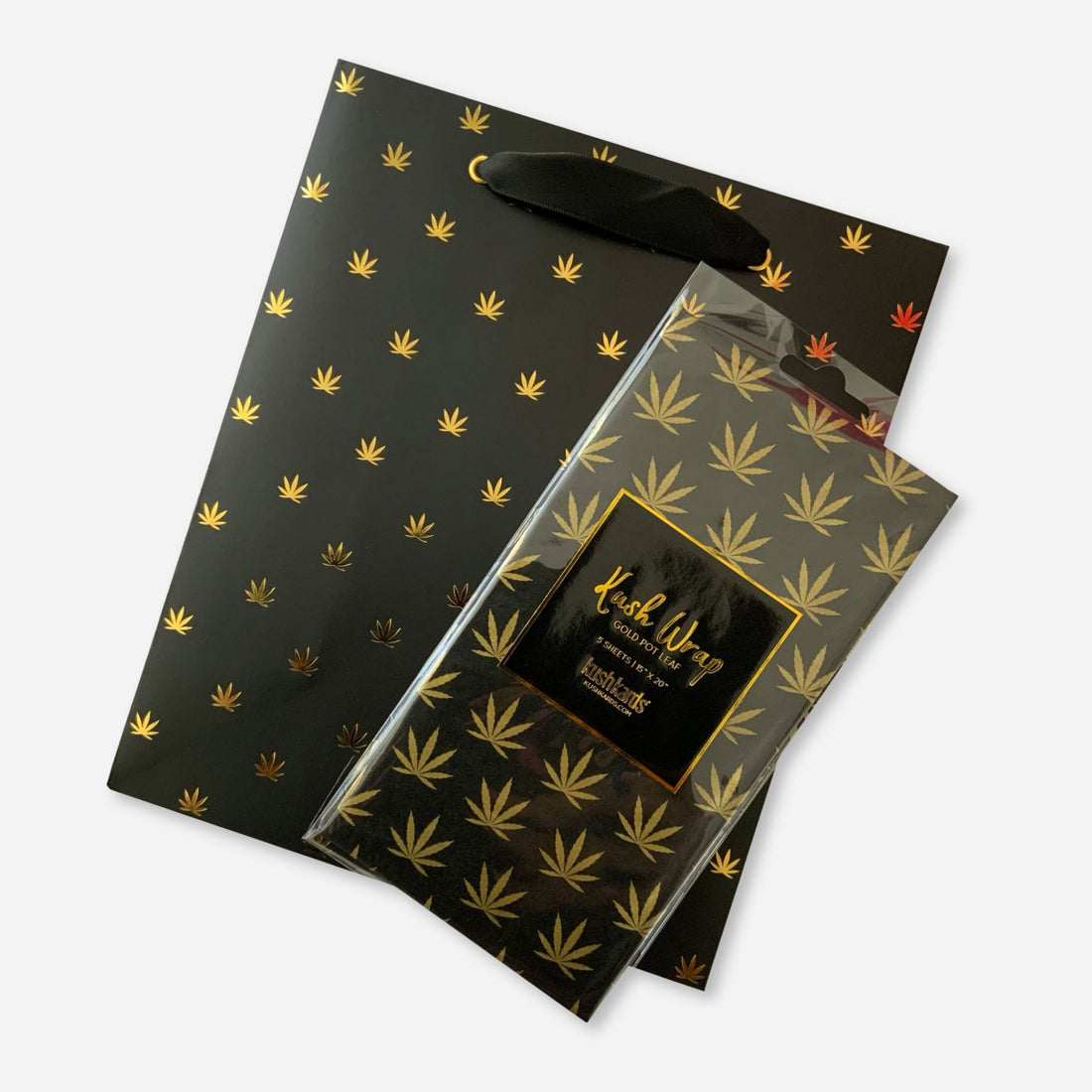 Black gift bag and matching gold pot leaf tissue paper combo set, perfect for elevated cannabis-themed gifting.