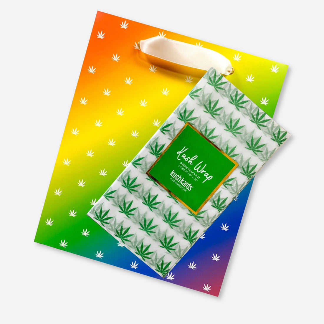 Rainbow gift bag and matching green pot leaf tissue paper combo set, perfect for elevated cannabis-themed gifting.
