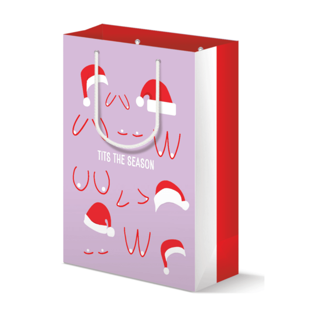 Large lavender holiday gift bag adorned with playful illustrations of santa hats resting on breasts, accompanied by the cheeky text &