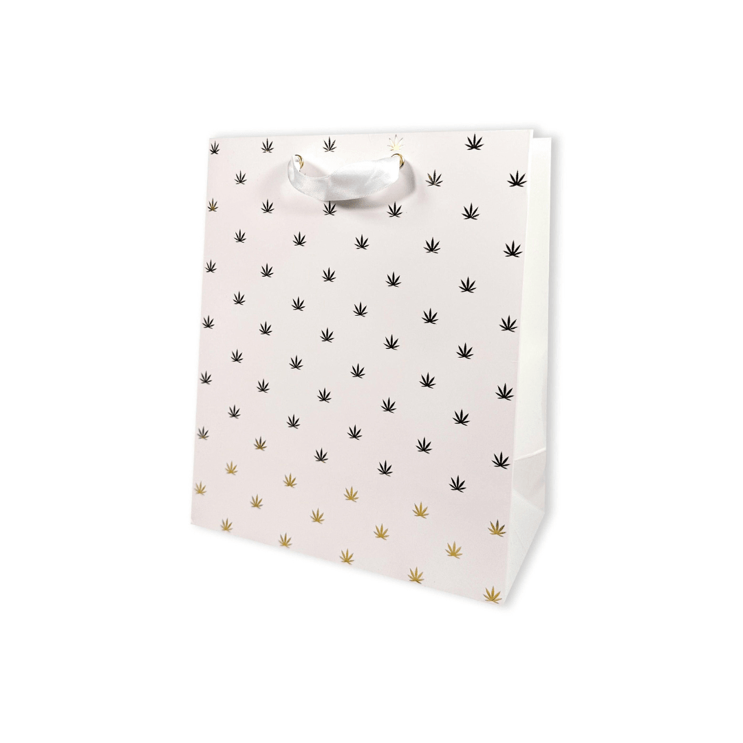 White gift bag with gold pot leaf print.