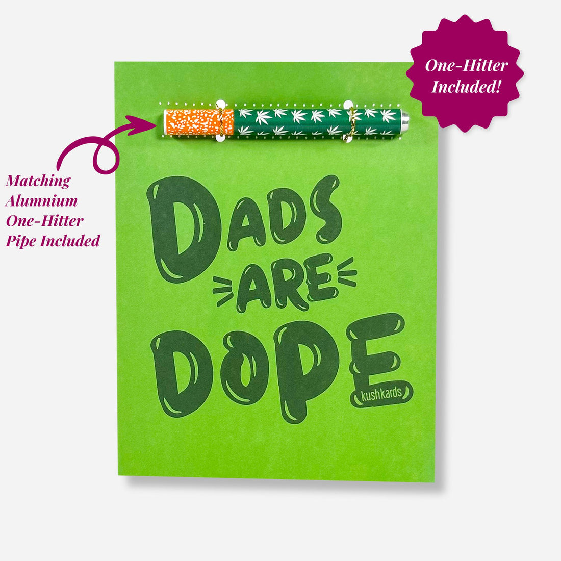 “Green greeting card with bold dark green text that reads ‘Dads Are Dope’. A matching aluminum one-hitter pipe with a green leaf pattern is attached horizontally above the text. A magenta badge says ‘One-Hitter Included’, with a note pointing out ‘Matching Aluminum One-Hitter Pipe Included’.”

