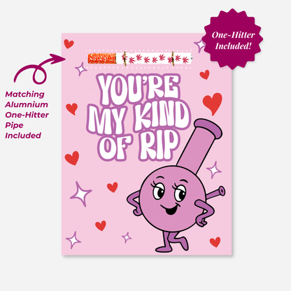 Pink Valentine’s cannabis greeting card reading “You’re My Kind of Rip” featuring a cute cartoon bong character, hearts and sparkles, with a matching aluminum one-hitter pipe attached at the top.

