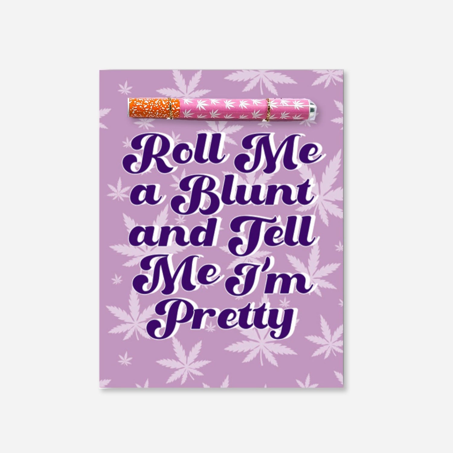 A playful cannabis-themed greeting card with bold text saying &quot;Roll Me a Blunt and Tell Me I’m Pretty,&quot; set against a purple background with leafy motifs with pink and white one hitter pipe 