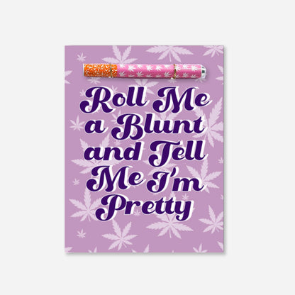 A playful cannabis-themed greeting card with bold text saying &quot;Roll Me a Blunt and Tell Me I’m Pretty,&quot; set against a purple background with leafy motifs with pink and white one hitter pipe 