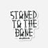White matte sticker with "STONED TO THE BONE" text made from bones and skull & crossbones.