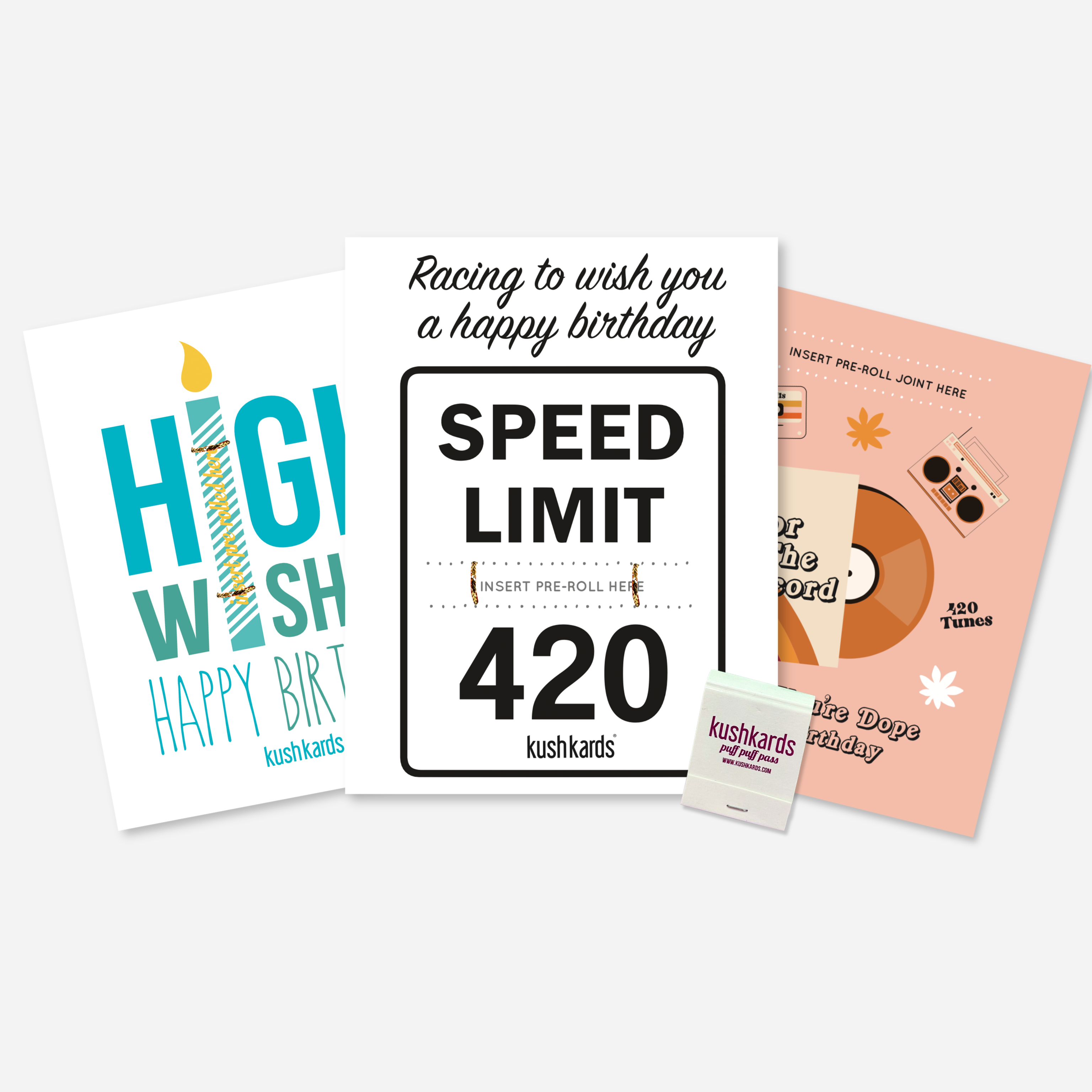 Three Stoner Birthday Greeting Cards with add a pre-roll slot and a branded kushkards matchbook on a light grey background 