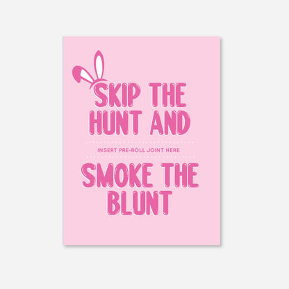 Pink greeting card with playful white bunny ears graphic and bold pink typography reading “Skip the Hunt and Smoke the Blunt.” The design features a dotted line for inserting a pre-roll joint. Fun and festive cannabis-themed card for spring celebrations. with a slot to insert a pre roll and matchbooks included 