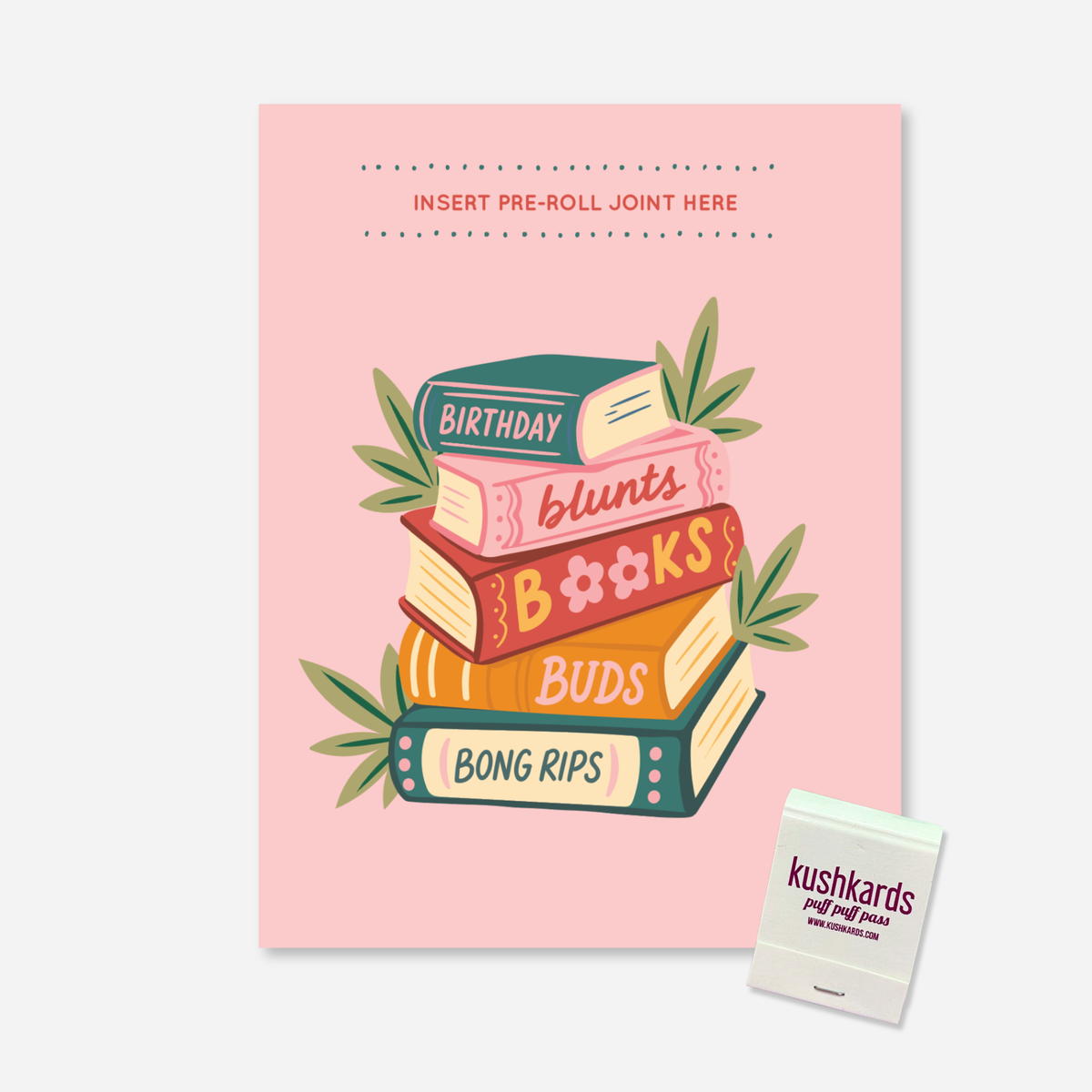 Birthday Blunts Books Buds and Bong Rips KushKards cannabis birthday greeting card featuring a soft pink background and a colorful illustrated stack of books surrounded by green cannabis leaves. The book spines read “Birthday,” “blunts,” “Books,” “Buds,” and “Bong Rips.” A built-in slot near the top is labeled “Insert Pre-Roll Joint Here” for adding a pre-rolled item of choice. A KushKards matchbook appears in the lower-right corner, 