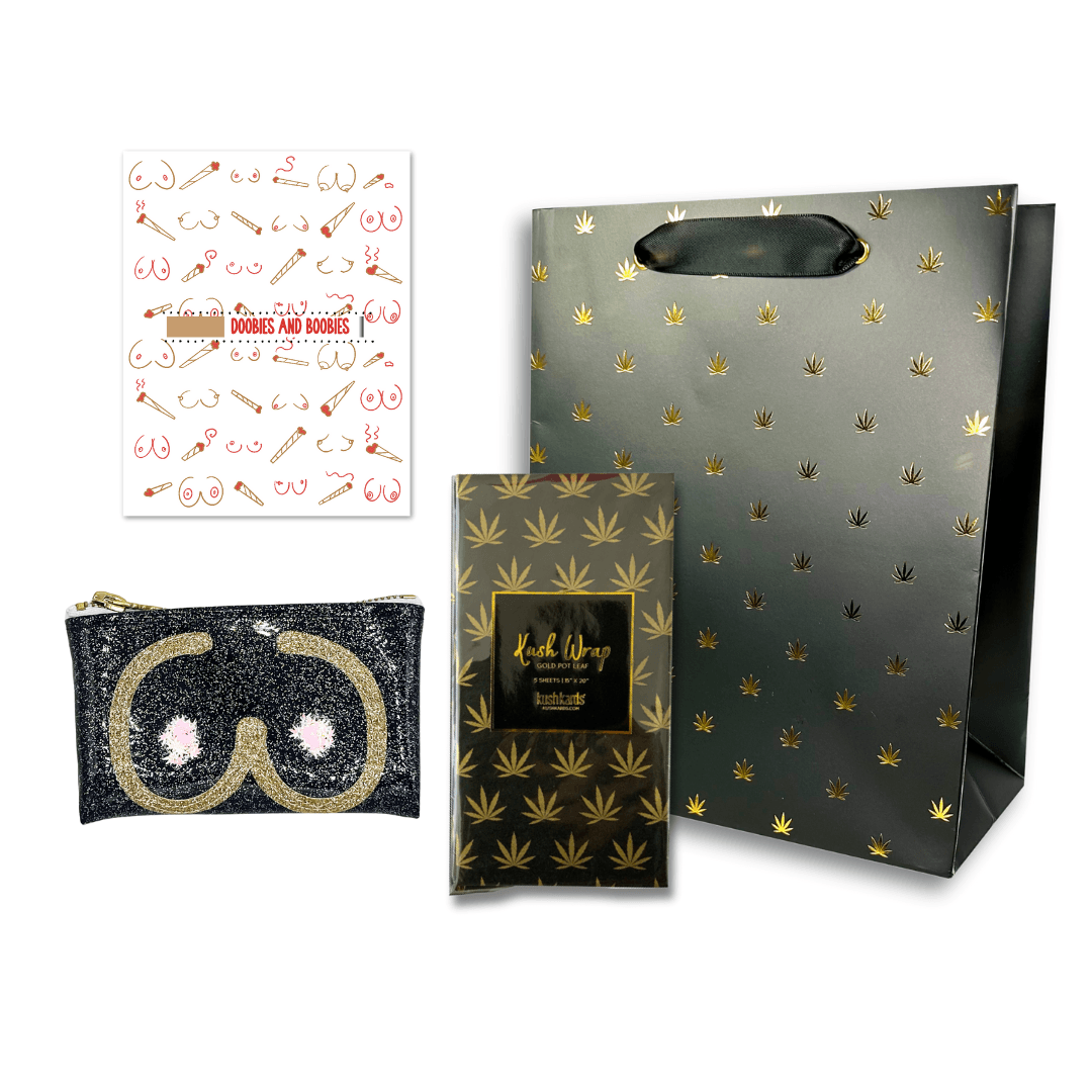 Charming 'Doobies & Boobies Kush Clutch Gift Bag Set' featuring smoking essentials and a sassy clutch, all wrapped in a stylish black and gold pot leaf print for the perfect present.