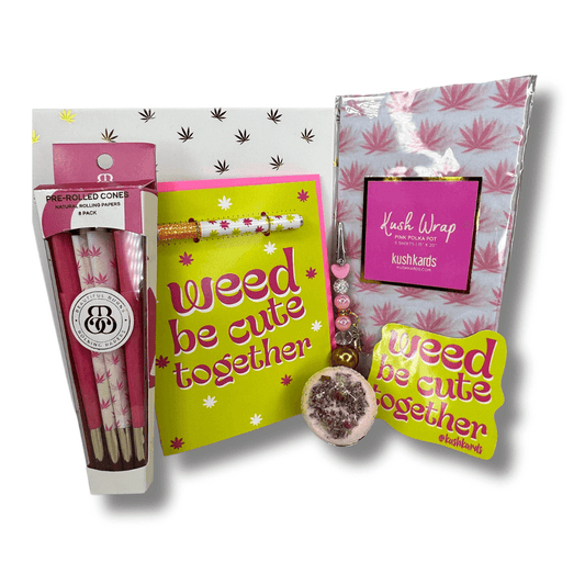 Weed Be Cute Together themed Valentine's gift box including a one-hitter card, bath bomb, sticker, roach clip, pre-roll cones, and pot leaf tissue paper, all in an elegant white and gold box for the ultimate romantic gesture.