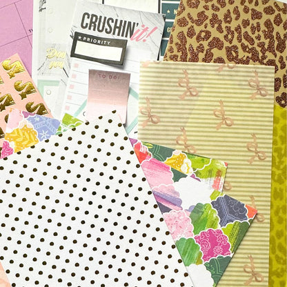 Assorted thrifted papers in pastel and glitter textures, featuring polka dots, bows, floral patterns and retro designs for creative stoners