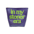 Purple travel bag with green text &