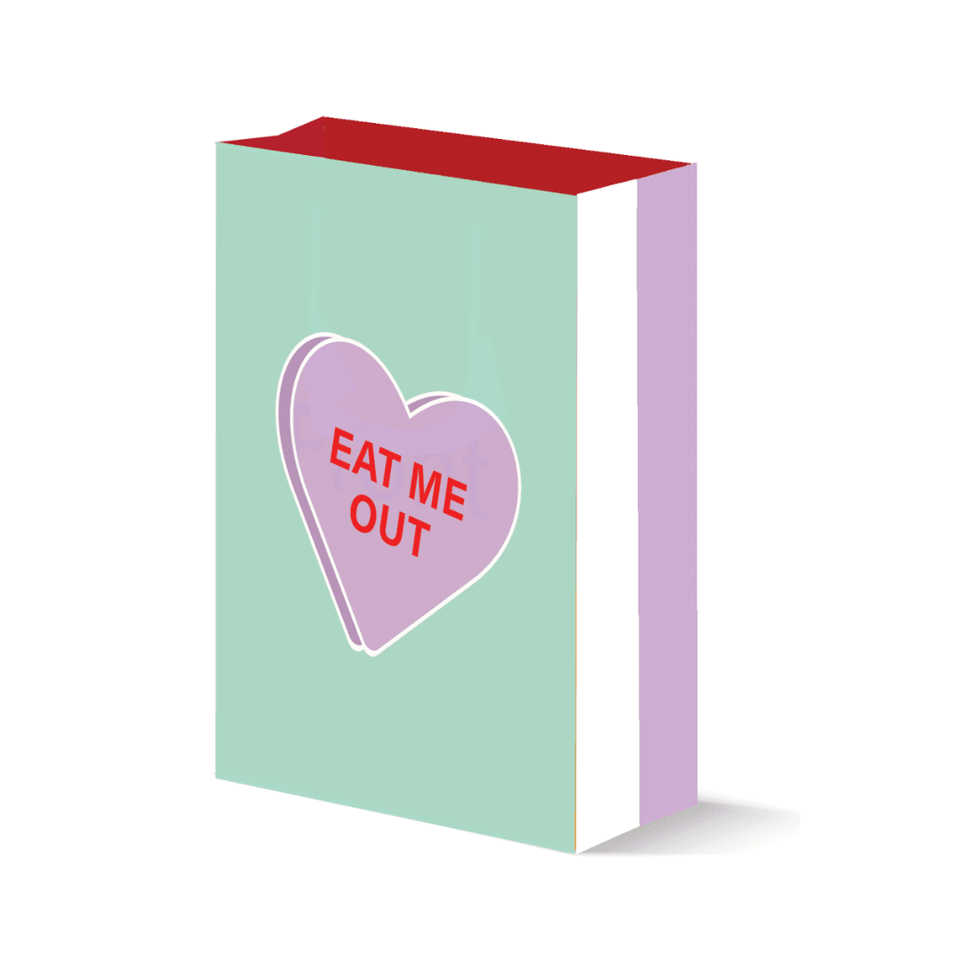 A tasteful sage-colored gift bag with a large purple Valentine's Day candy heart graphic prominently displaying the phrase 'Eat Me Out,' offering a playful and inviting design.